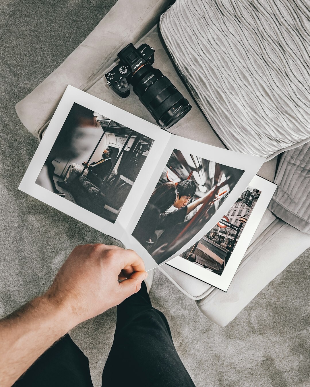 Hands comparing two printed photos side by side
