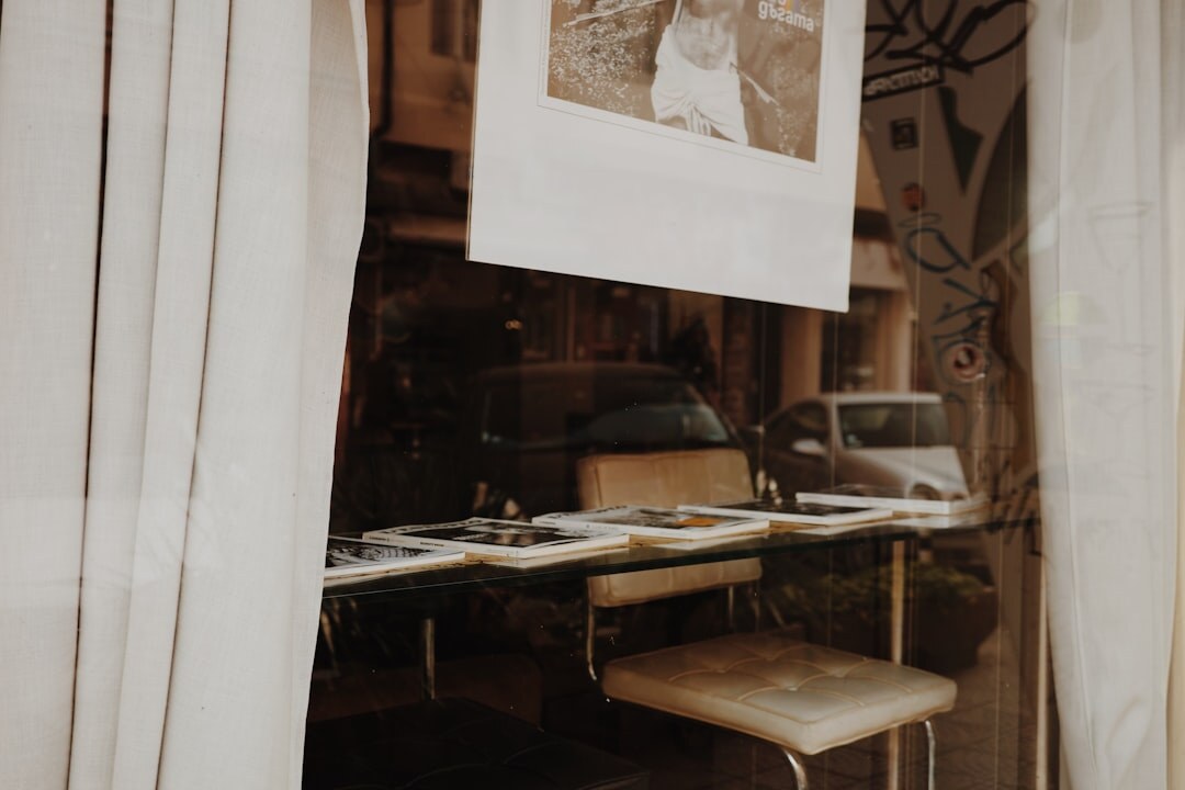 Magnifying glass over printed photographs on a table