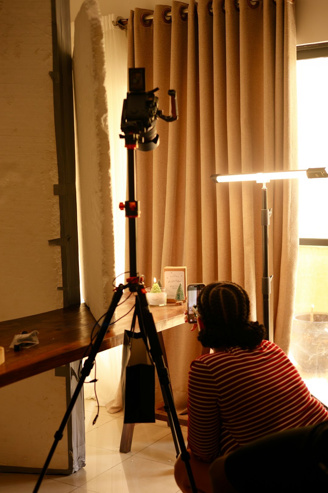 Smartphone filming a vertical video in a studio